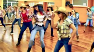 Cowgirls Kick Up Their Heels In Brooks & Dunn Line Dance