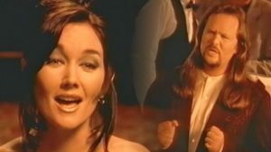 Lari White & Travis Tritt Sing About Lost Love In Video For Their Duet, “Helping Me Get Over You”
