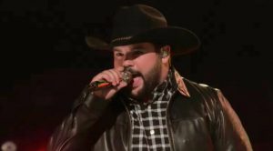 ‘Voice’ Cowboy Embraces Inner Outlaw With Rowdy Rendition Of Travis Tritt Hit