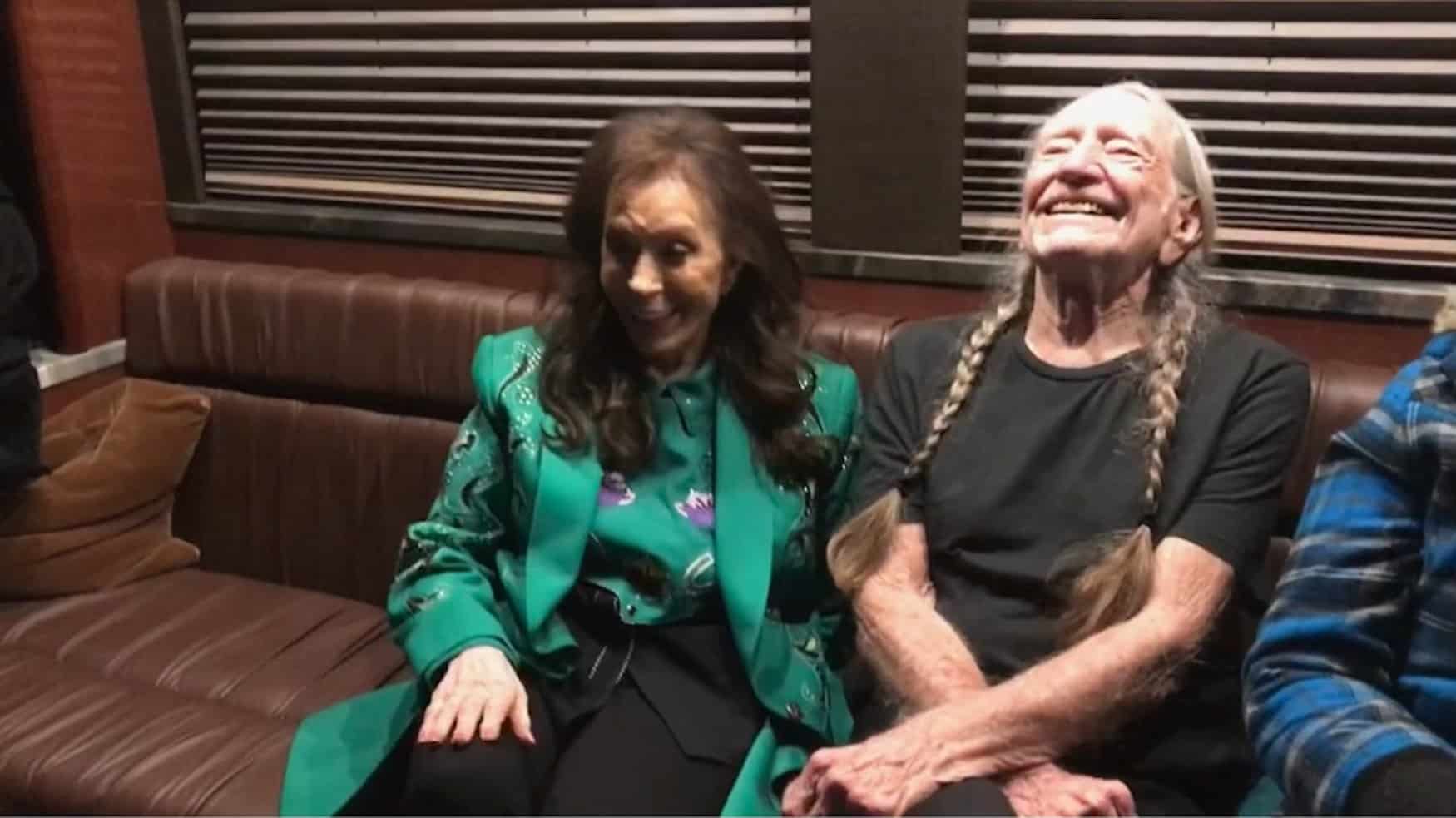 Loretta Lynn in a candid photo with Willie Nelson