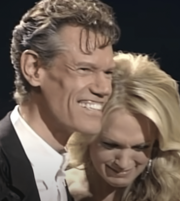 Randy Travis surprises Carrie Underwood with invitation to join the Grand Ole Opry