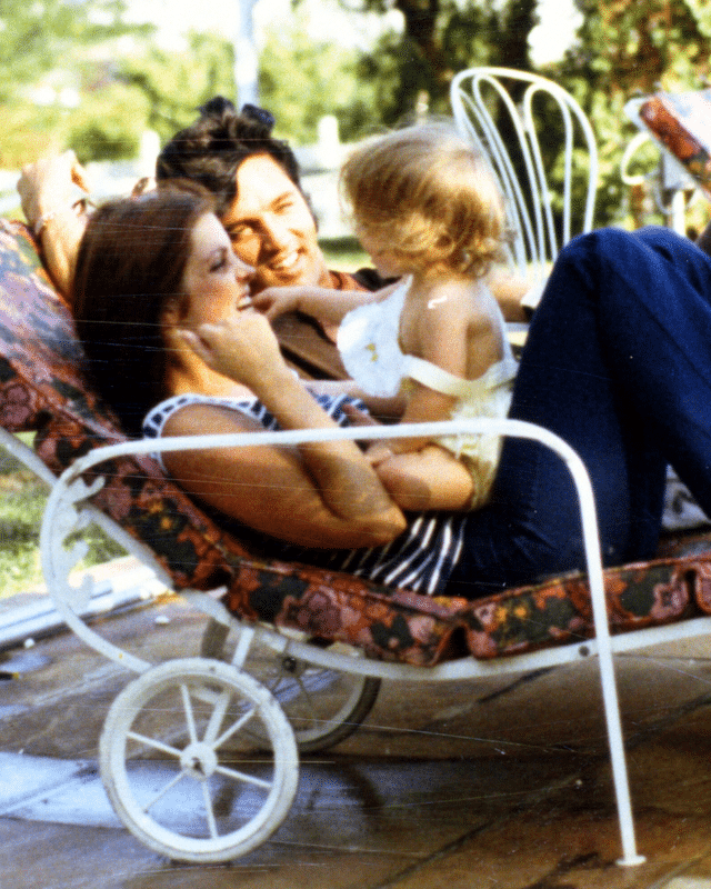 Priscilla Presley with Elvis and a young Lisa Marie