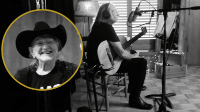 Photo of Willie Nelson singing.