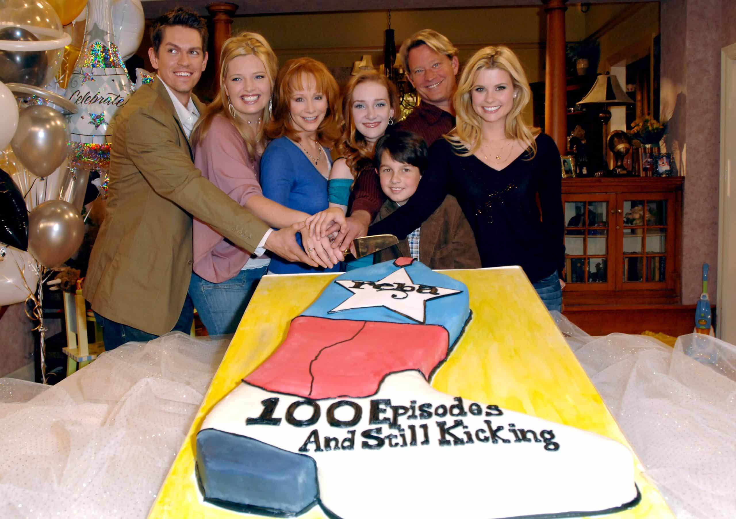 Reba McEntire set to star in new sitcom over 20 years after her previous namesake show, "Reba," debuted. Here, she is pictured with members of the cast celebrating their 100th episode.