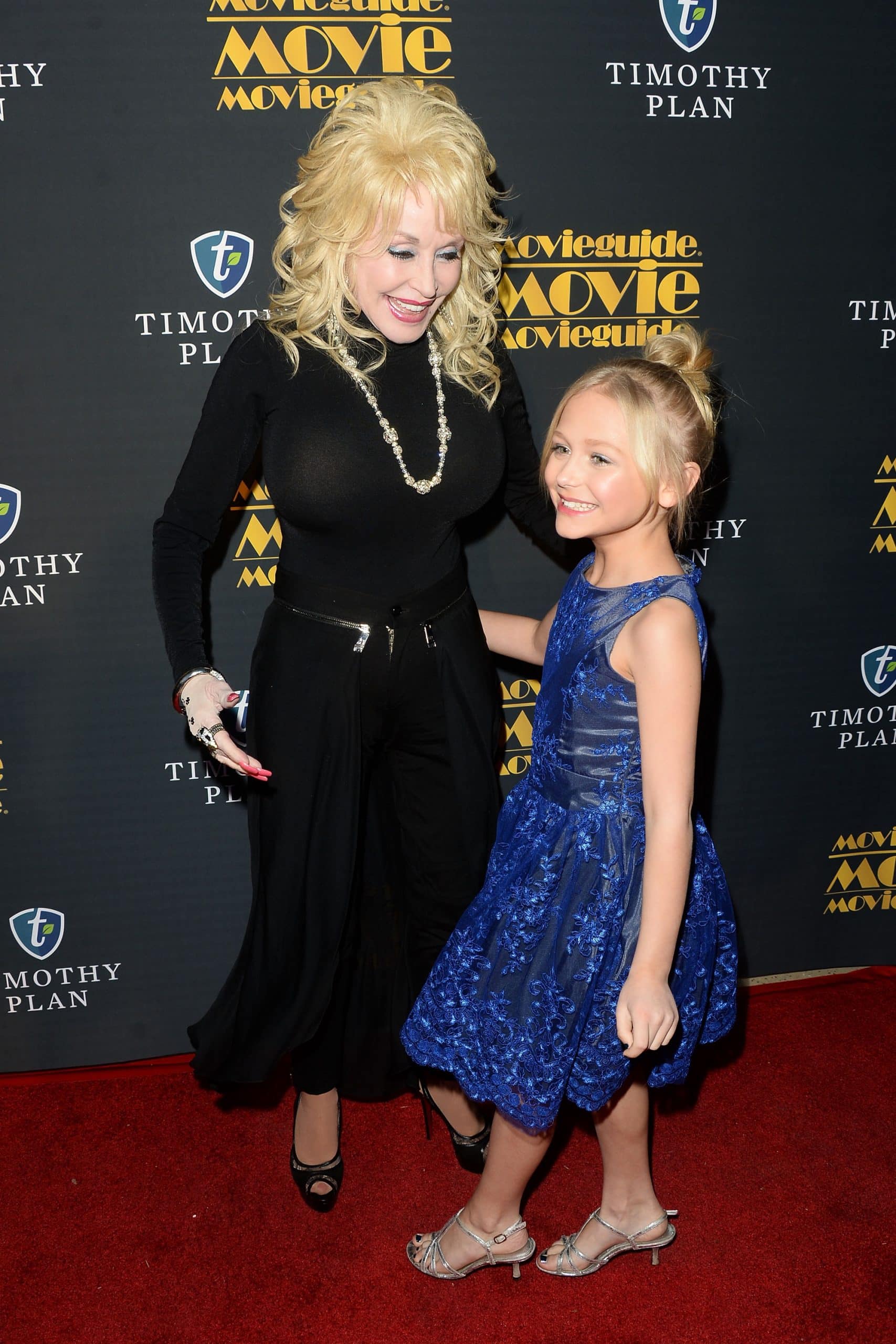 Alyvia Alyn Lind, the actress who played Dolly Parton in the Coat of Many Colors movies, is pictured here with Dolly at the 24th annual Movieguide Awards Gala at Universal Hilton Hotel in 2016.