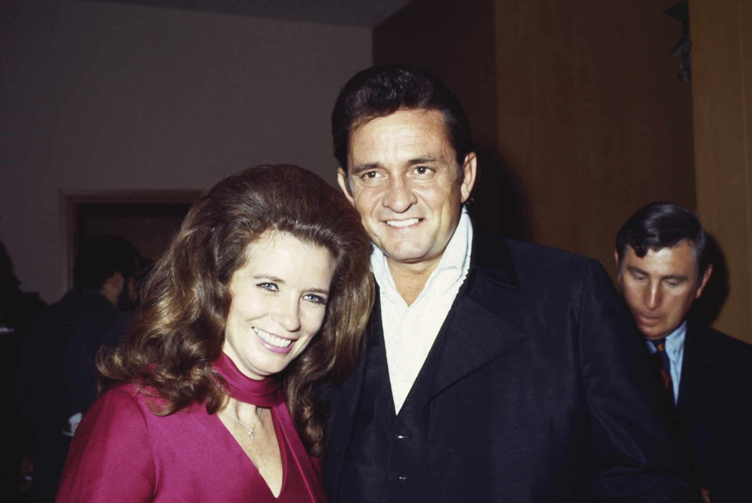 CALIFORNIA - SEPTEMBER 1969: Married country singers Johnny Cash & June Carter Cash pose for a portrait at an event in September 1969 in California. (Photo by Michael Ochs Archives/Getty Images)