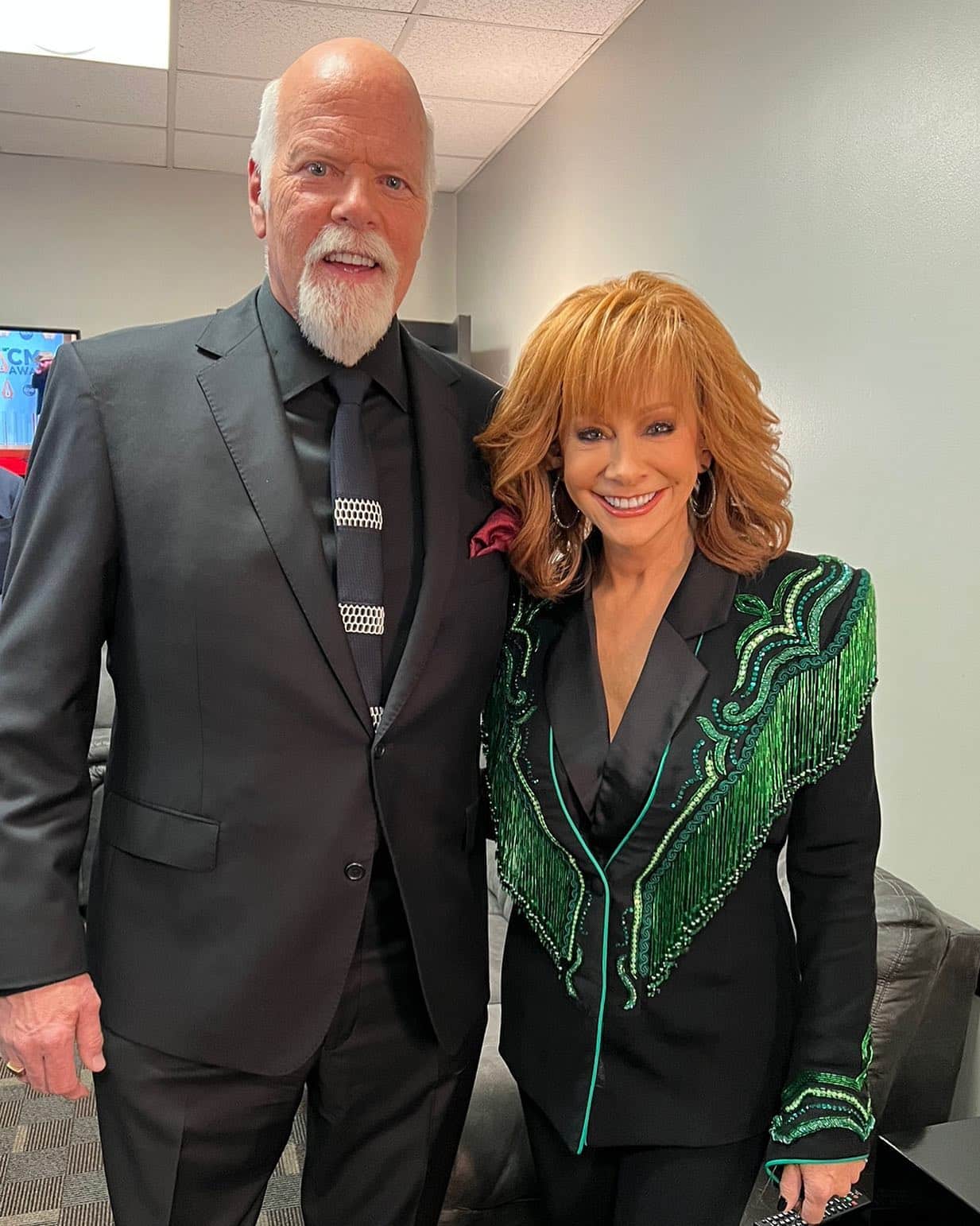 Reba McEntire questioned why she didn't fall in love with her boyfriend, Rex Linn, earlier in life. Here, they're photographed backstage together at an event.