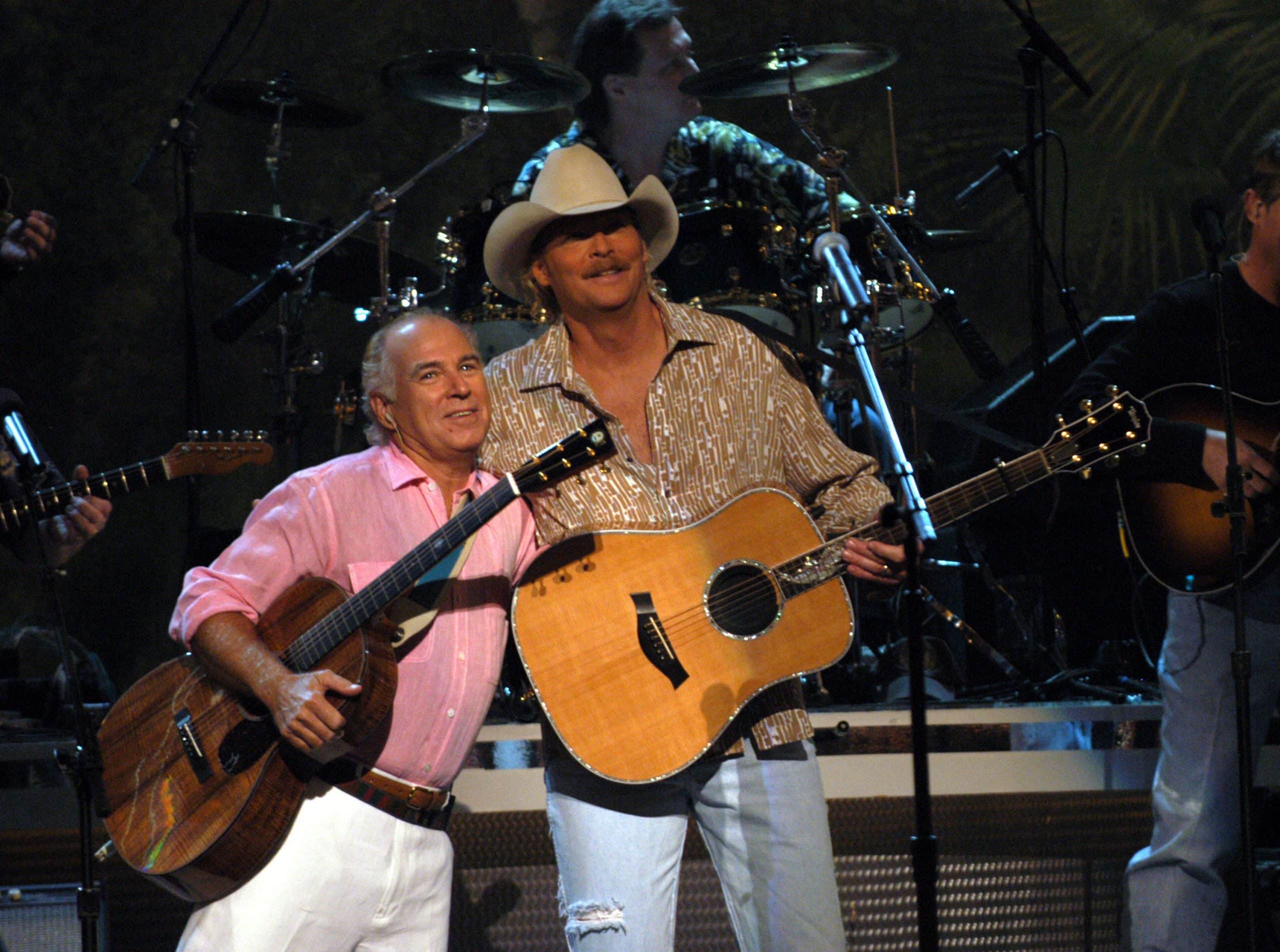 Alan Jackson and Jimmy Buffett share a hug after performing their song "It's Five O'Clock Somewhere"