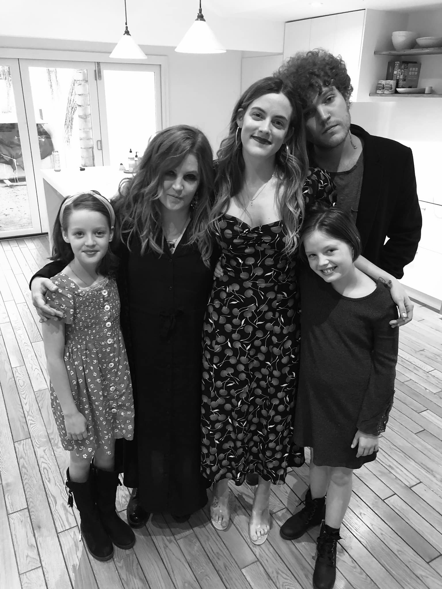 Lisa Marie Presley's twin daughters Harper and Finley Lockwood appear in a photo with their mom, sister Riley, and brother Benjamin in 2019