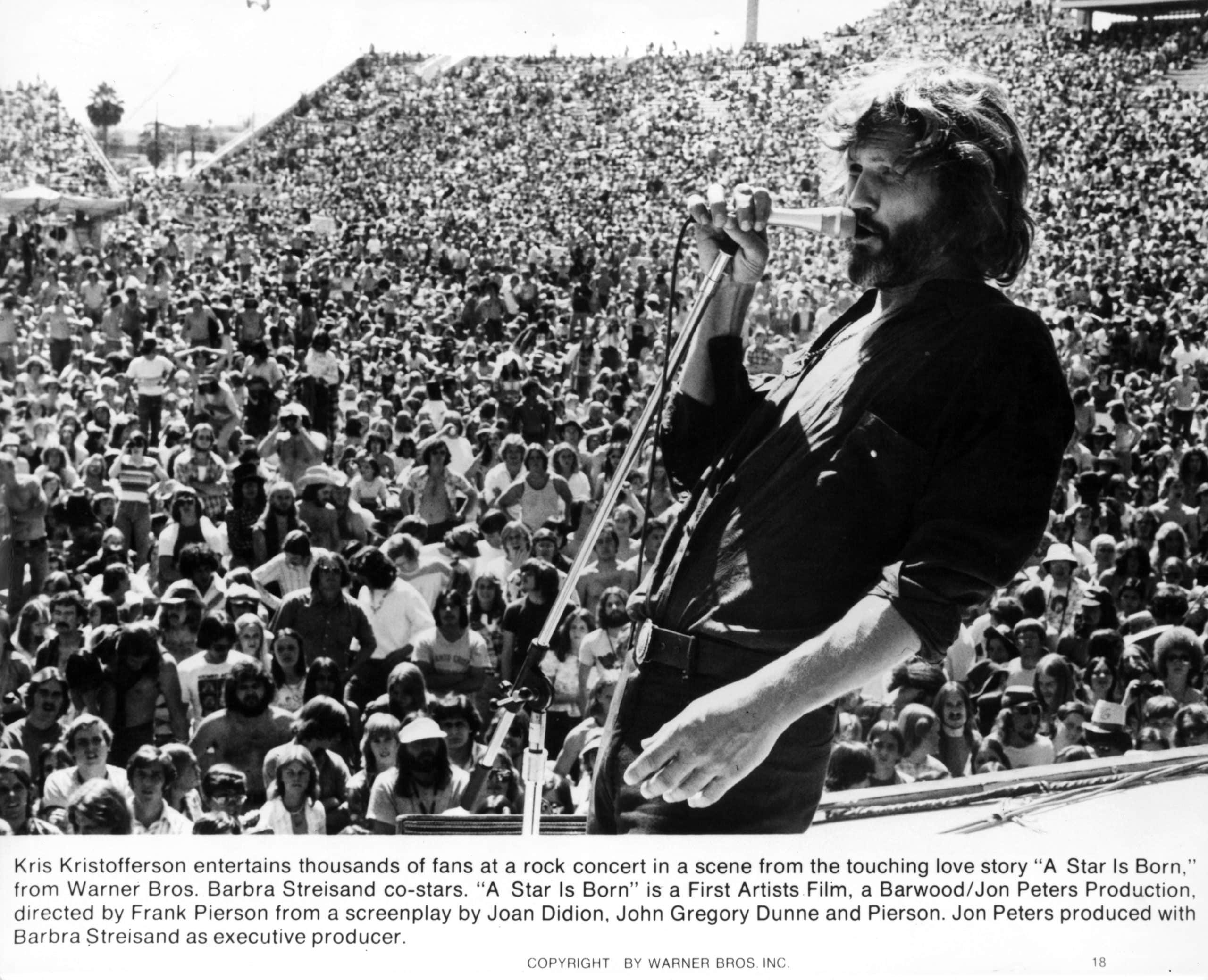 Kris Kristofferson sings on stage in a scene from the film 'A Star Is Born', 1976. (Photo by Warner Brothers/Getty Images)