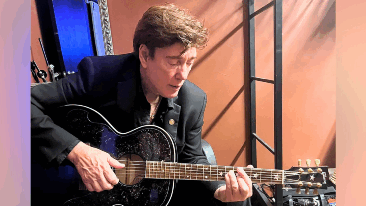 Ronnie McDowell plays guitar backstage at some point before his recent hospitalization