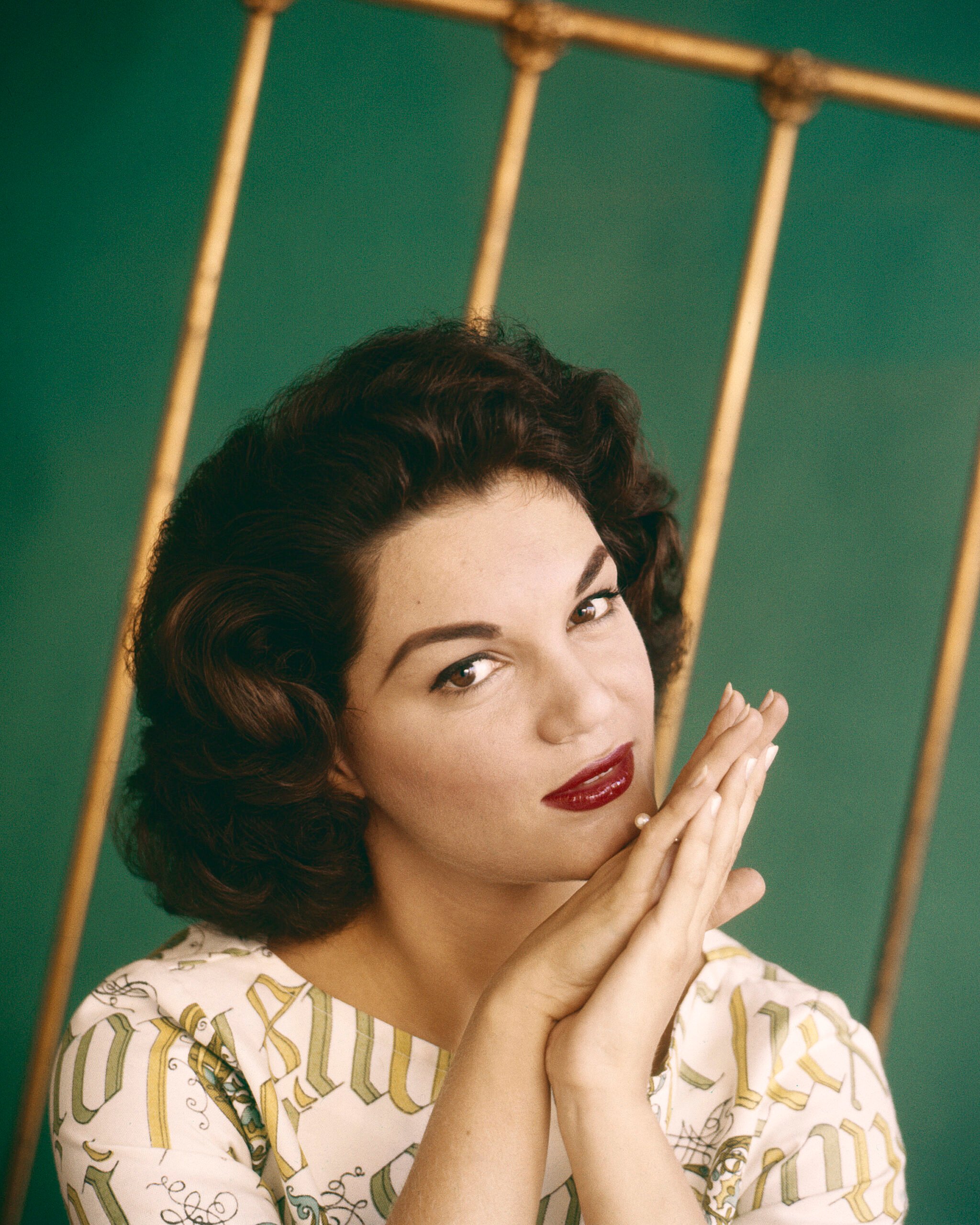 Portrait of the late singer Connie Francis against a golden and green background